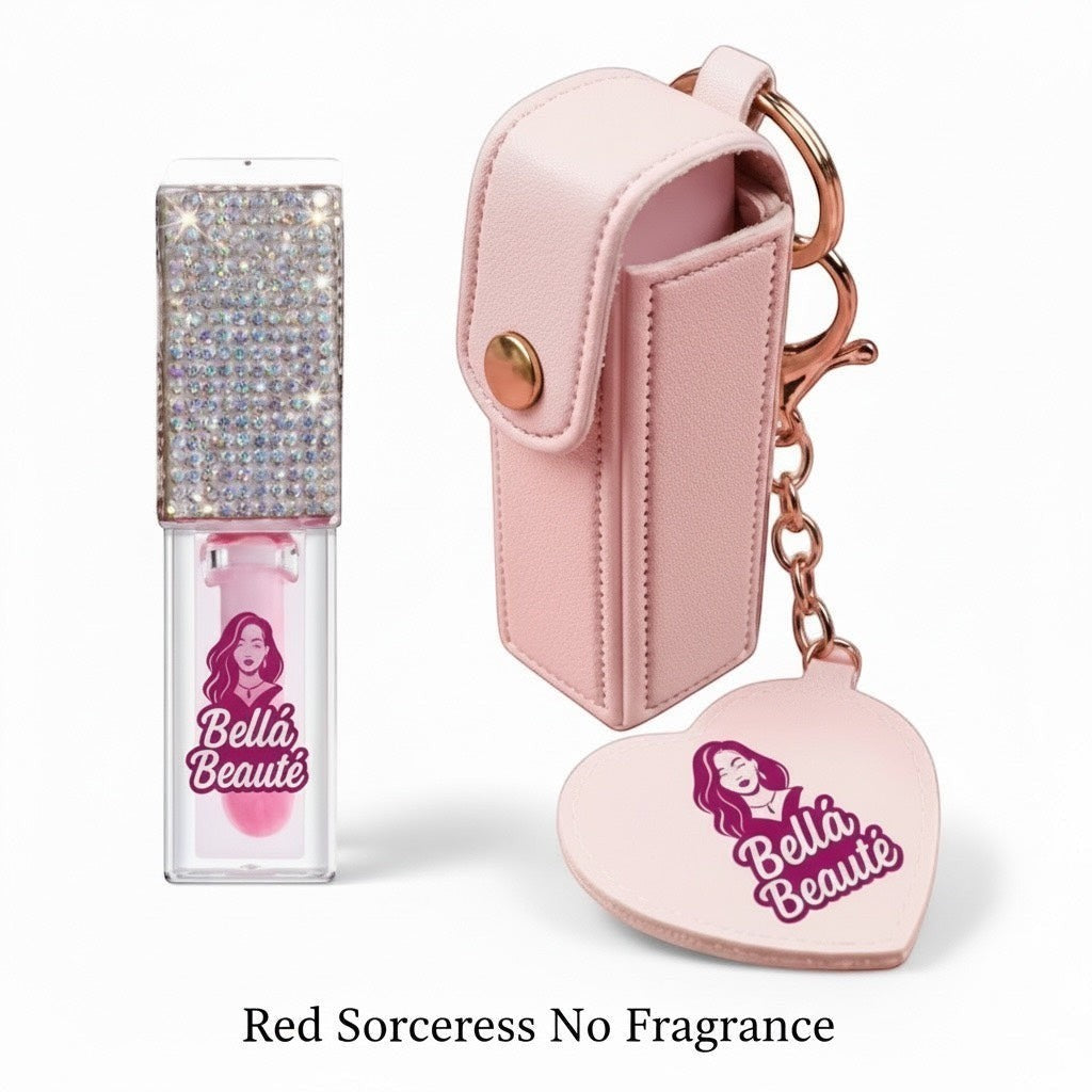Bella Beauté magic color-changing lip oil with rhinestone cap and pink keychain holder. Adjusts to pH for custom color.