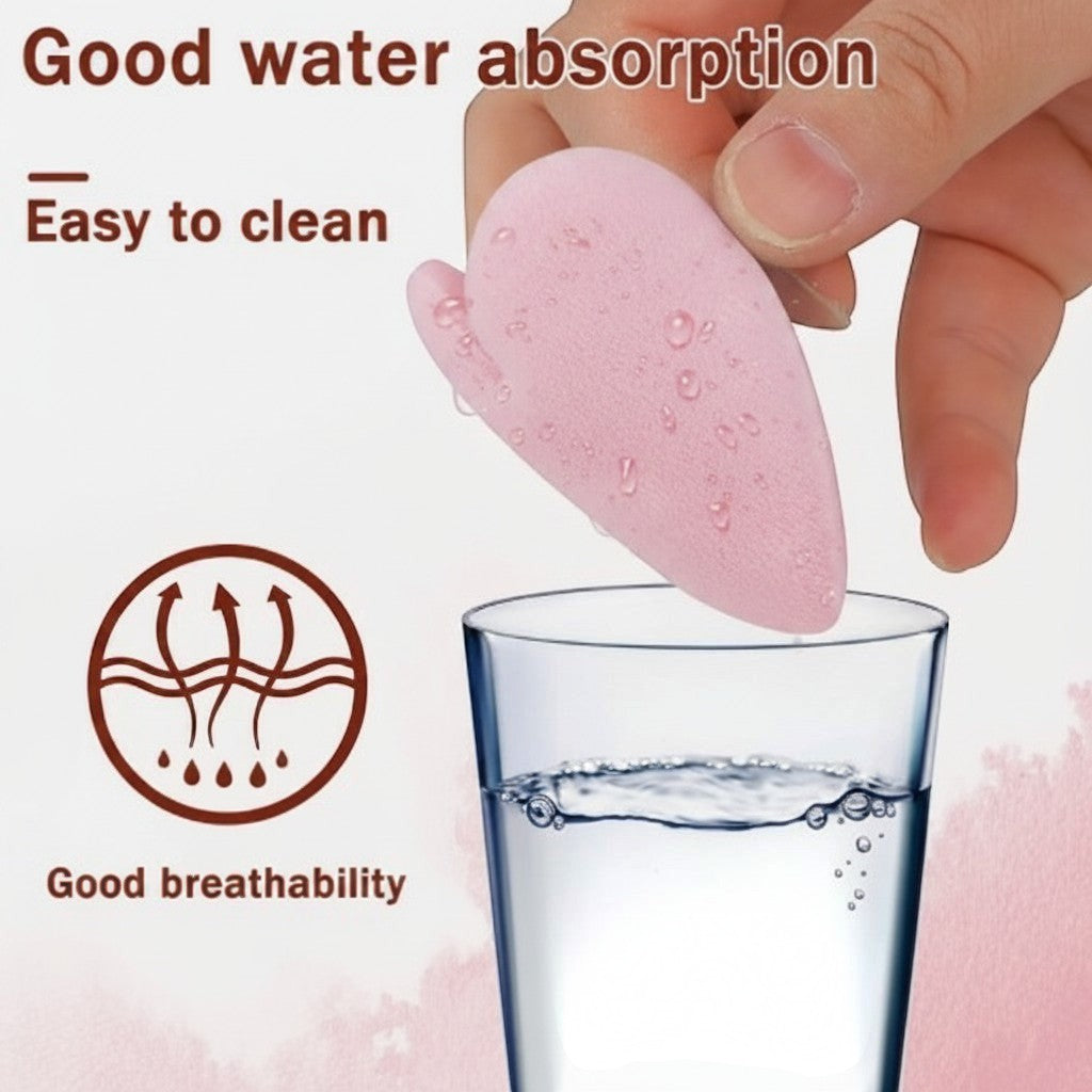 Bella Beauté light blue heart-shaped powder puff being dipped into water, showing good water absorption and breathability.