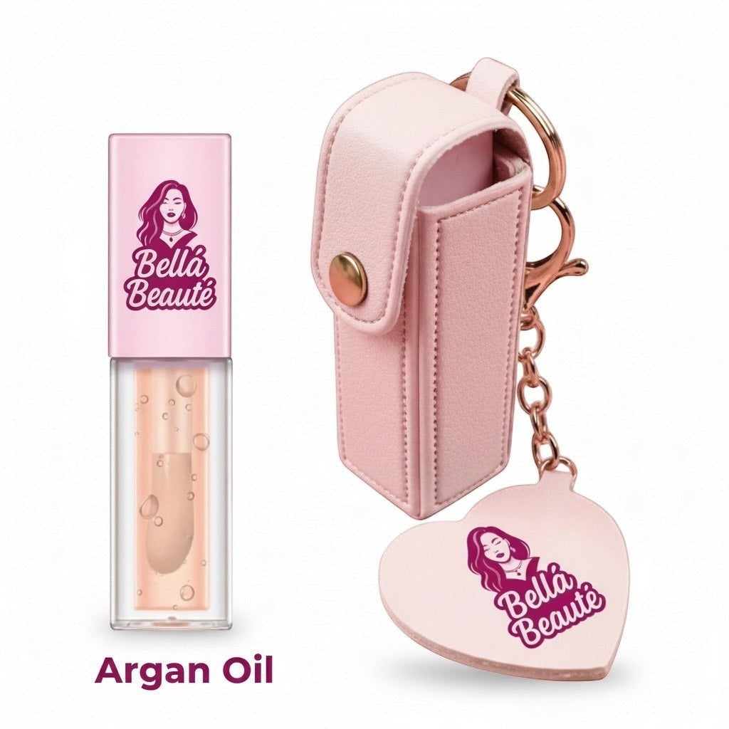 Bella Beauté pink faux leather keychain with heart charm and lip oil. Argan oil lip gloss.