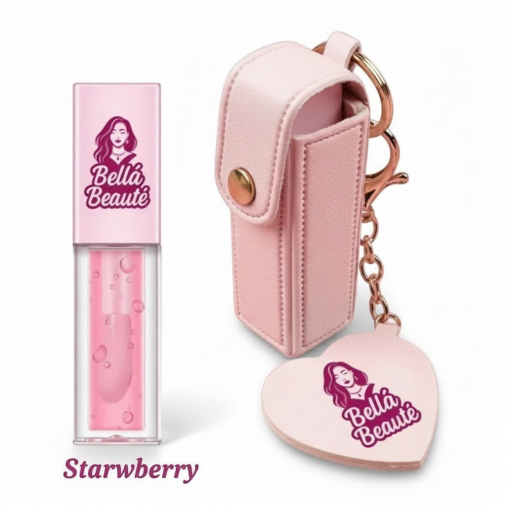 Bella Beauté pink faux leather lip oil keychain with a heart-shaped charm and a hydrating Starberry flavored lip oil.