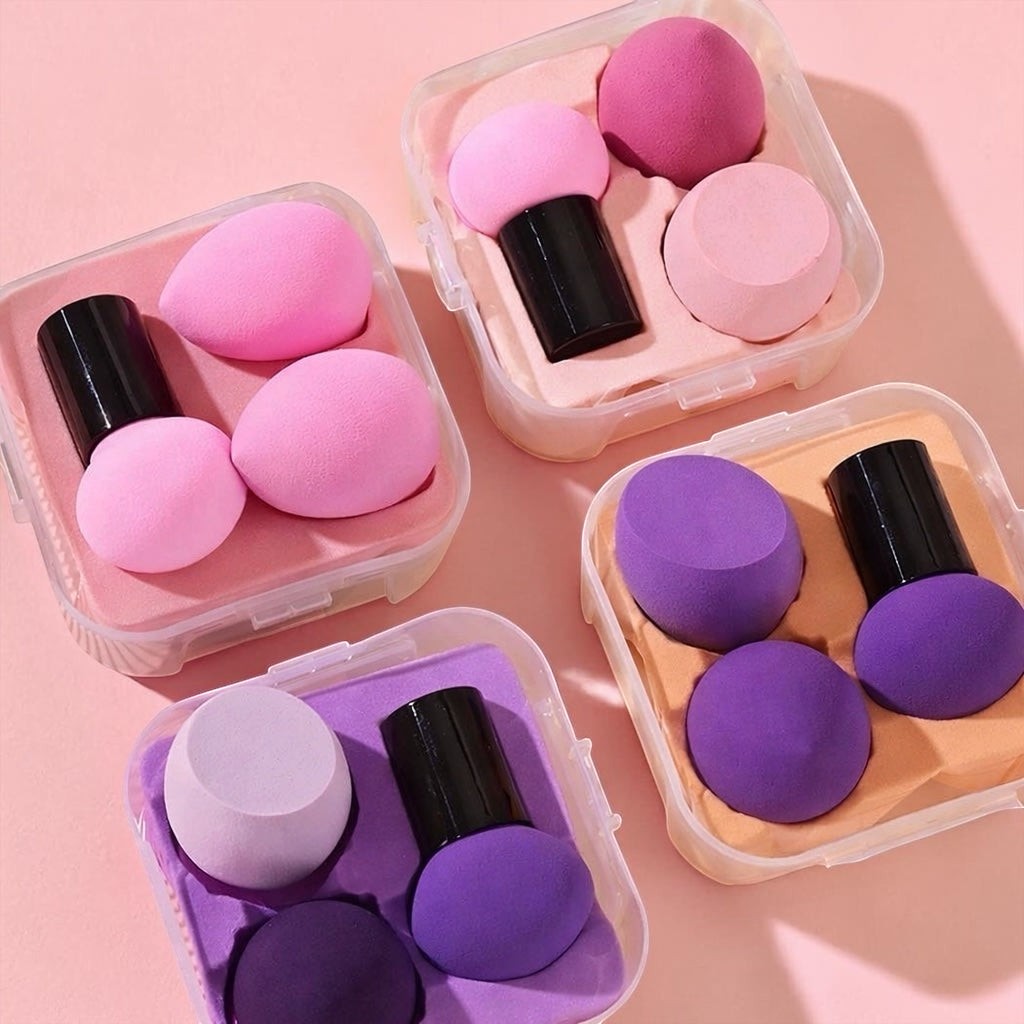 Bella Beauté pink and purple makeup sponges in travel cases. Includes teardrop and mushroom shapes for blending.